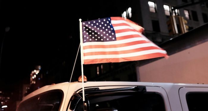 american flag flying from truck.jpg.optimal